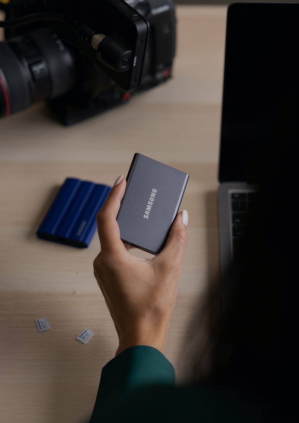 Portable SSDs and media next to a cinema camera