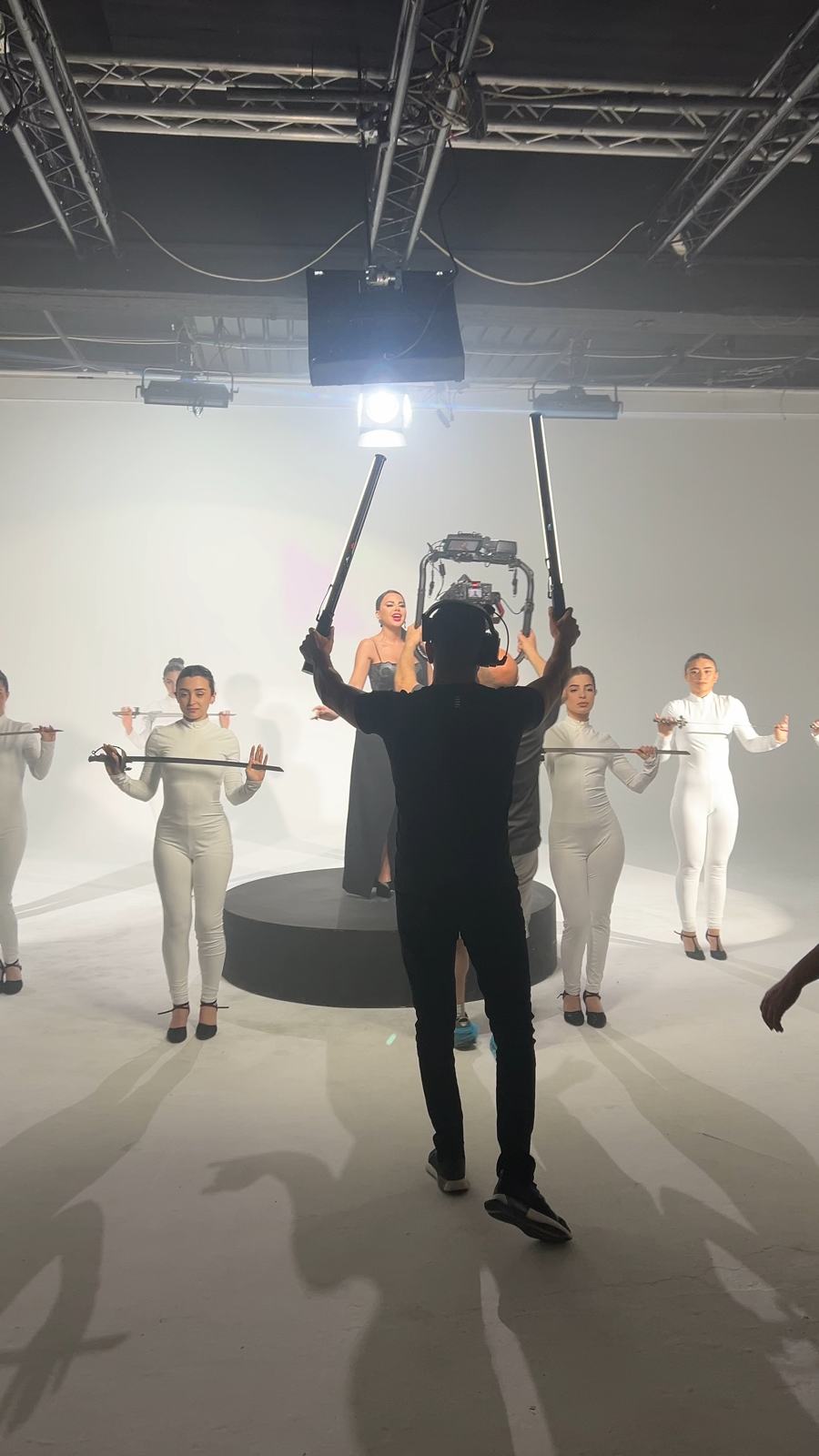 Dancers rehearsing on a white studio stage